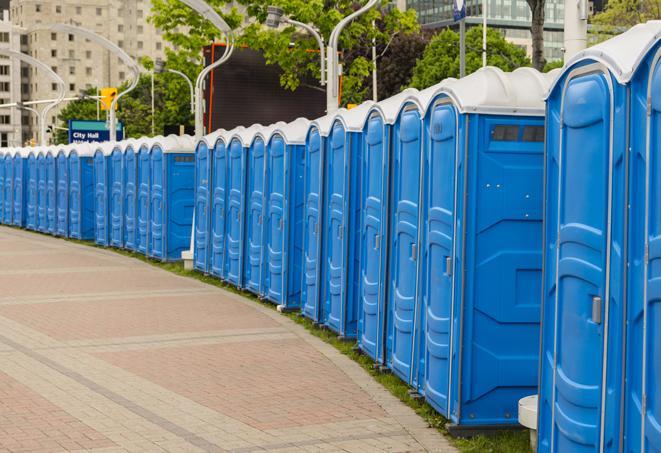 a clean row of portable restrooms for outdoor weddings or festivals in Akron